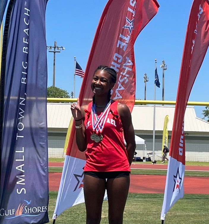 St. Michael Catholic junior Tia Acker not only won all three of her events at the Class 4A state championship meet in Gulf Shores but she also broke an eight-year-old meet record in the 200-meter dash.