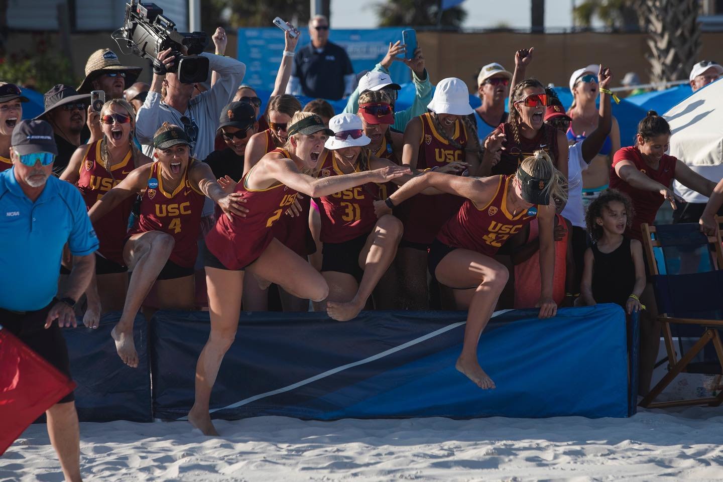The USC Women of Troy storm the court after they won their fourth national title Sunday afternoon in Gulf Shores over Florida State.