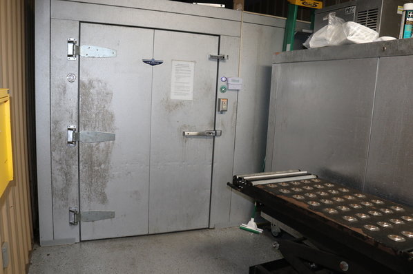 The cooler in the Baldwin County Coroner's Office is a temporary holding facility for bodies. The number of cases investigated by the office increased from 460 in 2019 to 660 in 2021.