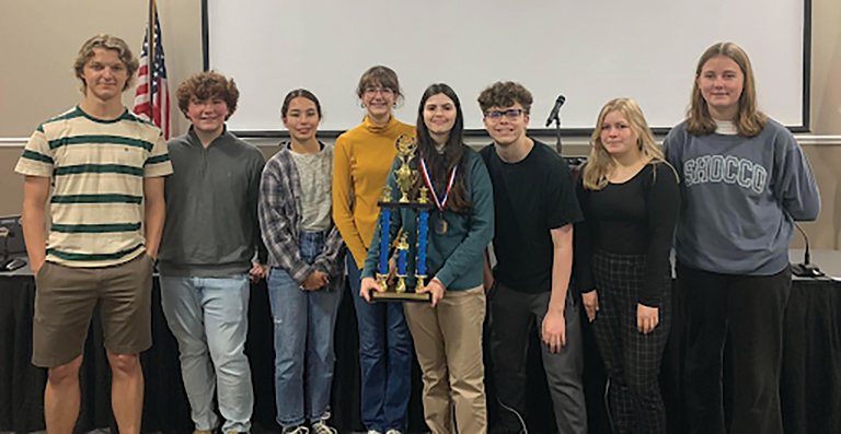 The high school junior varsity first place team from Daphne High School included from left: Kent Ward, Eli Lores, Miyu Haskel, Elysa Nelson, Avery Darly, Jake Houston, Meredith Hunsader, Katie Smith and Addi Emmertson (not pictured).