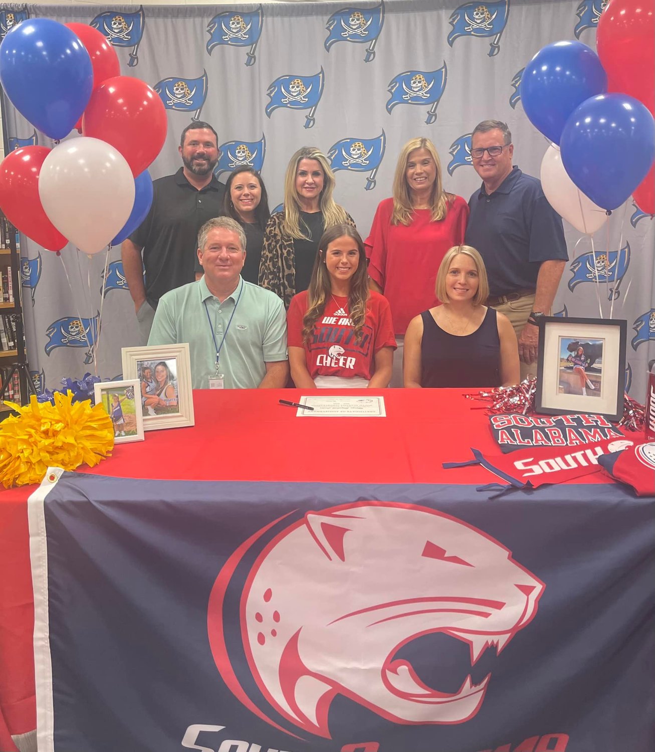 Maryn Lester, a recent graduate of Fairhope High School, inked her commitment to cheer for the University of South Alabama Jaguars in the fall during a May 17 ceremony at the high school. Her family joined her at the signing ceremony.