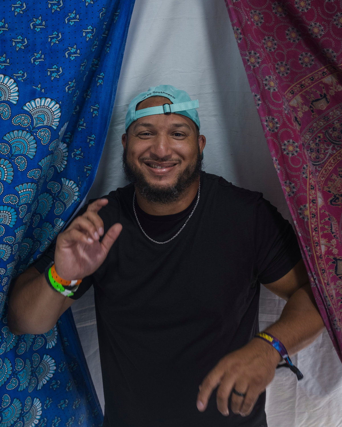 Martise Colston, a sign language interpreter with Amber G. Productions, stands for a portrait at the media tent during Hangout Fest.