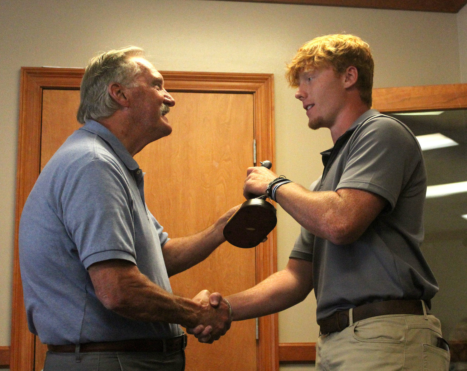 Mobile Sports Hall of Famer Randy McGilberry presented Daphne’s Jackson Howard with the Midtown Optimist Club Baldwin County Player of the Year award May 25 at the Azalea City Golf Club.