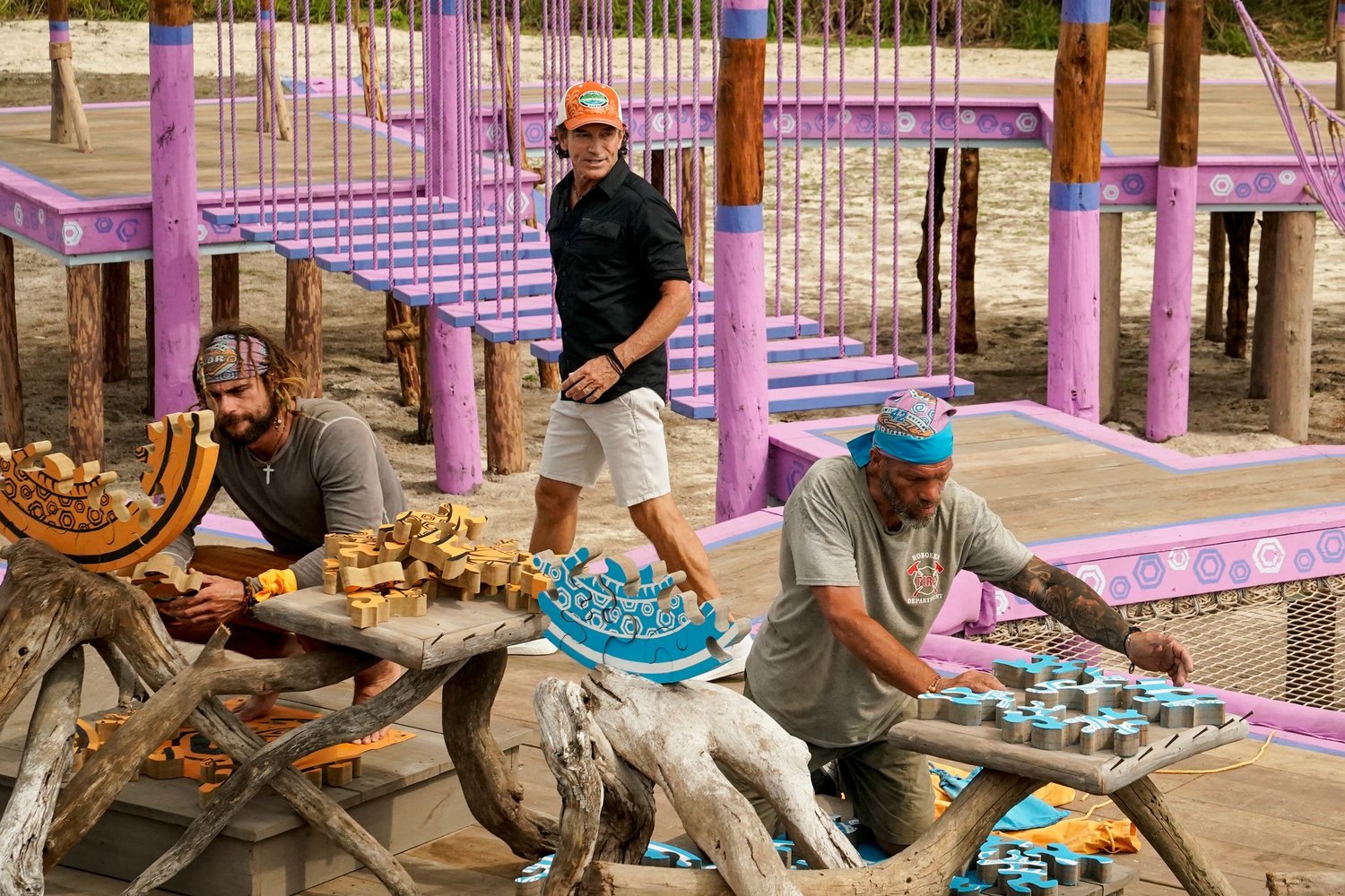 Baldwin County's Jonathan Young and castaway Mike have worked together since the merge. Will their alliance get them to the final three? Above, Young and Mike work on a large circular puzzle to win immunity.