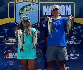 Elizabeth Eastman and Walker Jenkins show off some of their haul from Day 1 of the  Alabama Bass Nation High School State Championship on Lake Eufala last weekend.