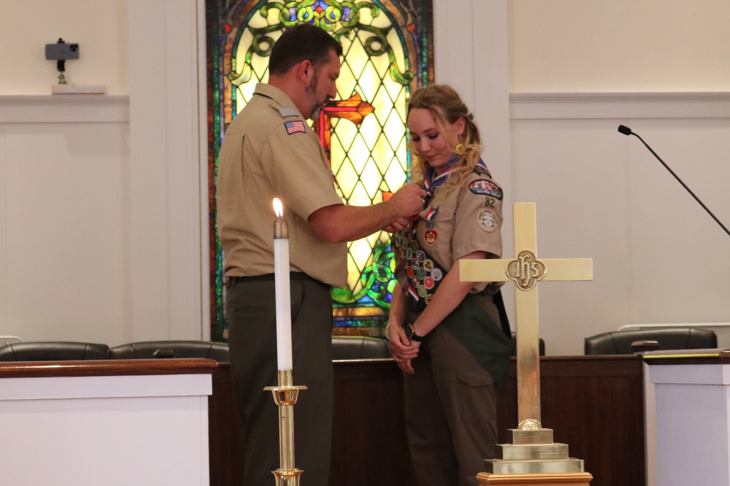 New Eagle Scout Dorothy Myers is presented her first two Eagle Palms by her father, John. Eagle Palms are awarded to those who earn five, 10, 15 or more merit badges beyond the 21 required to become an Eagle Scout.