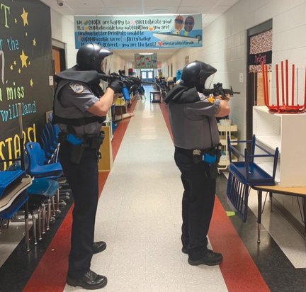 Spanish Fort police officers take part in an active shooter drill at Rockwell Elementary School after the end of the academic year. The department conducted drills for two days following the school shooting at Uvalde, Texas.