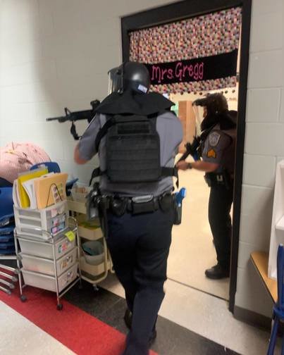 Spanish Fort police officers take part in an active shooter drill at Rockwell Elementary School after the end of the academic year. The department conducted drills for two days following the school shooting at Uvalde, Texas.