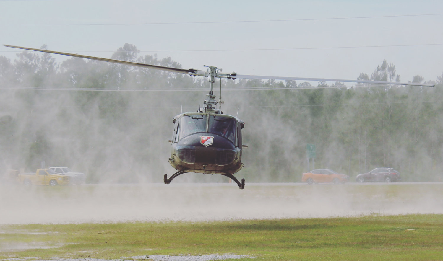 A Vietnam-era "Huey" lands at the helipad at The Wharf. The Friends of Army Aviation will offer flights in the multipurpose utility helicopter.