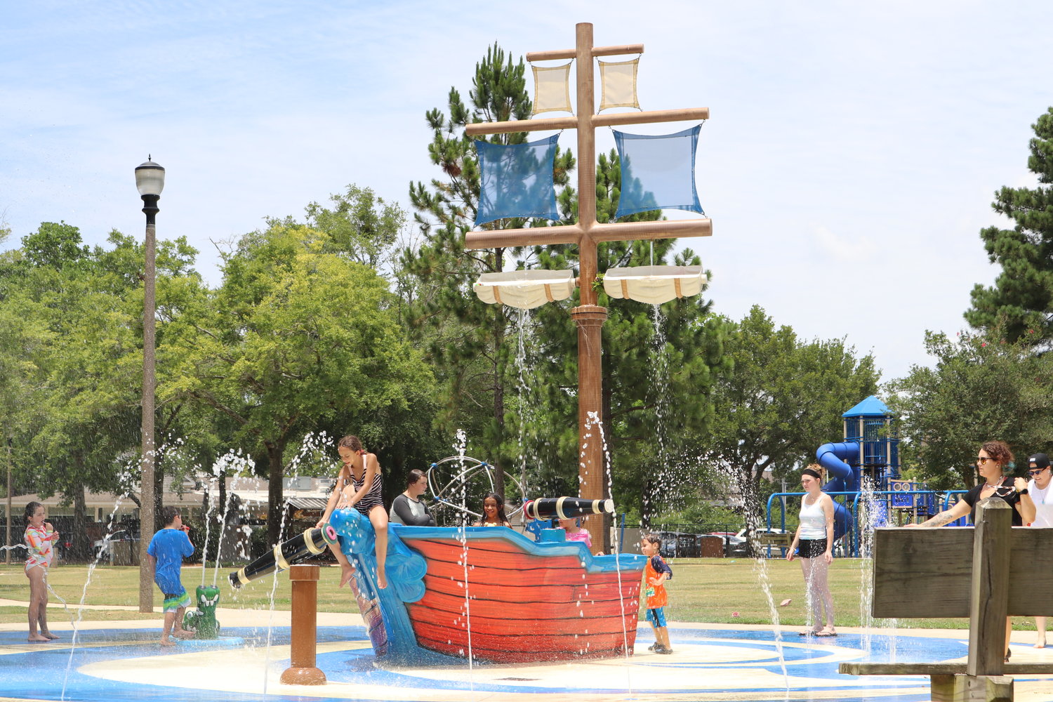 Children play on the splash pad at Fairhopers Community Park. The splash pad will be closed Monday during water conservation measures.