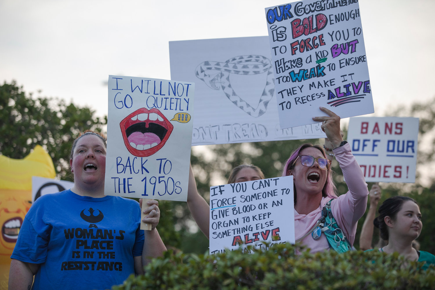 A group of protestors gather outside of the Fairhope Civic Center in opposition to the United States Supreme Court decision to overturn Roe v. Wade.