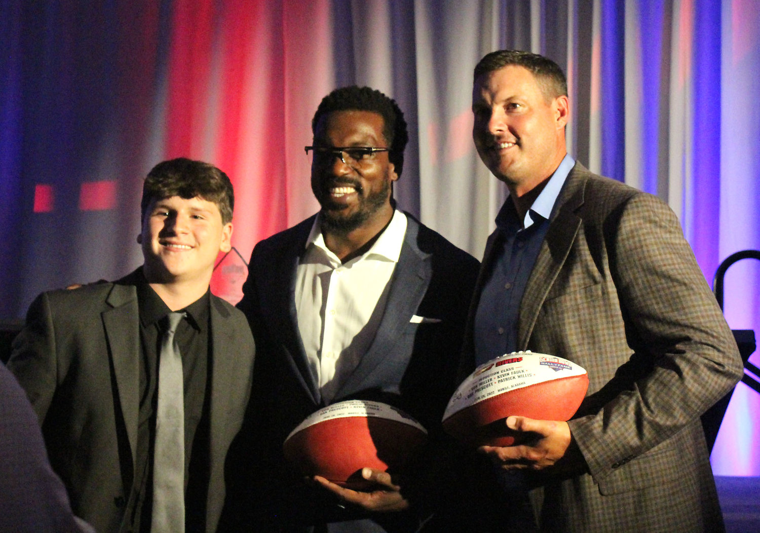 Senior Bowl Hall of Famers Philip Rivers and Patrick Willis pose for a picture after Sunday night’s induction ceremony at the Grand Hotel Golf Club & Spa in Point Clear.