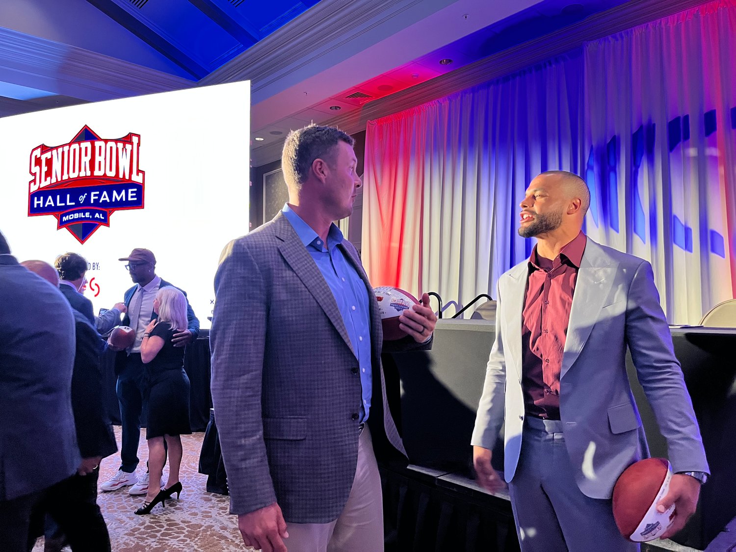Quarterbacks Philip Rivers and Dak Prescott converse after the Senior Bowl Hall of Fame ceremony at the Grand Hotel Golf Club & Spa in Point Clear Sunday night, June 26.