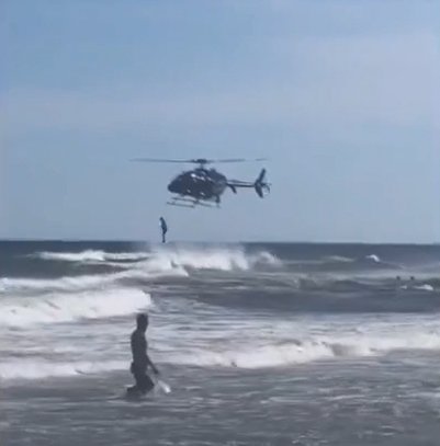 PHOTO PROVIDED
A Gulf Shores lifeguard jumps from an Alabama Law Enforcement Agency helicopter into the water at Gulf Shores during a training exercise. State helicopters helped city lifeguards rescue 38 swimmers over the Memorial Day weekend.