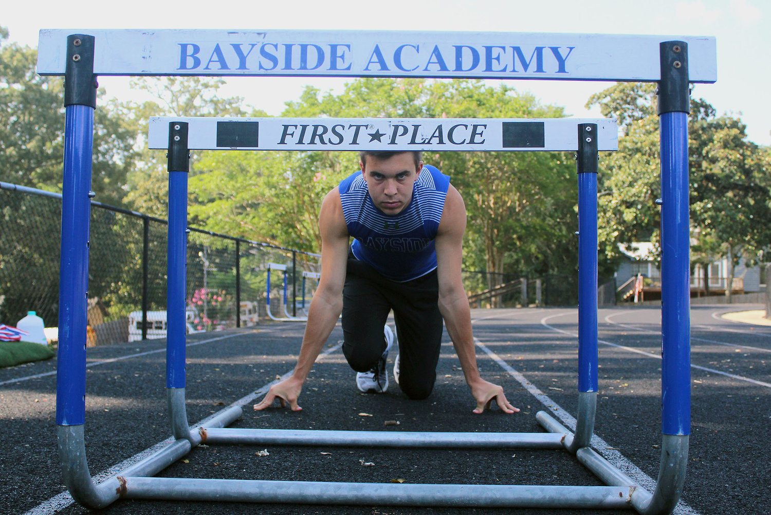 Bayside Academy’s Patrick Daves eyes the hurdles during a June 23 workout at Freedom Field in Daphne. Daves captured a third All-American honor when competing in a pair of national meets ahead of joining the Alabama Crimson Tide track and field team this fall.