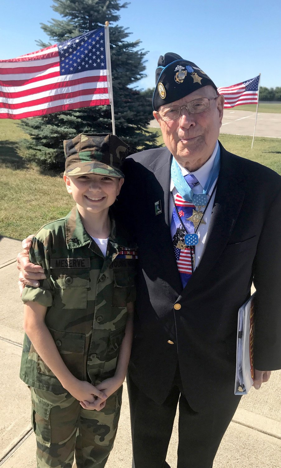 YM/Lance Cpl. Cara Meserve from the Miami Valley Young Marines in Huber Heights, Ohio with Medal of Honor recipient Hershel Woody Williams.