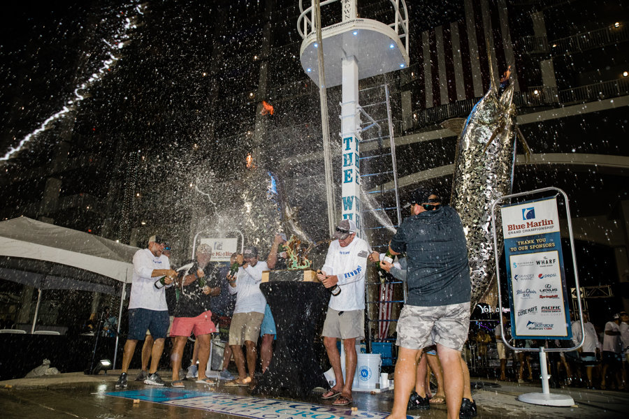 Skin Deep celebrated with a champagne shower after it won the 2021 Blue Marlin Grand Championship at The Wharf in Orange Beach. The team overcame early boat troubles to win the event.