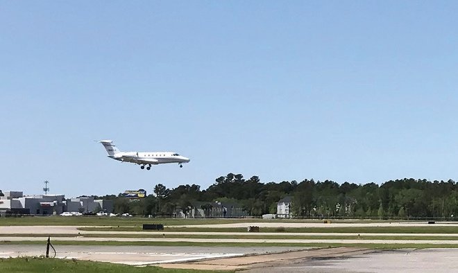 A jet lands on the main runway at the Gulf Shores Airport. The Airport Authority is planning improvements on the taxiway next to the runway and other work using $894,175 from a Federal Aviation Administration grant as well as authority and state funds.