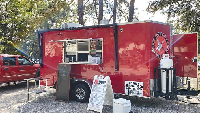Tin-Tins Rock and Roll Food Truck serves its No. 1 favorite, shrimp tacos, and a variety of foods popular with locals, such as lumpia and pancit.