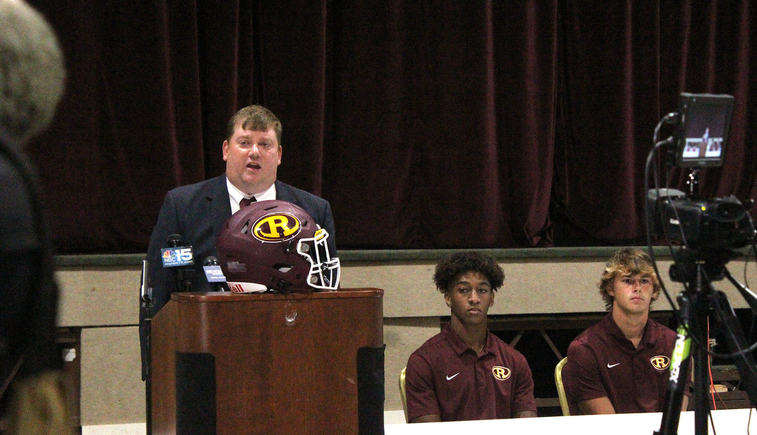 Robertsdale head coach Kyle Stanford answers a question during last Wednesday’s Baldwin County Media Day at Daphne High School previewing the upcoming season. He was joined by seniors Braydon Davis and Christian Abrams in representing the Golden Bears.