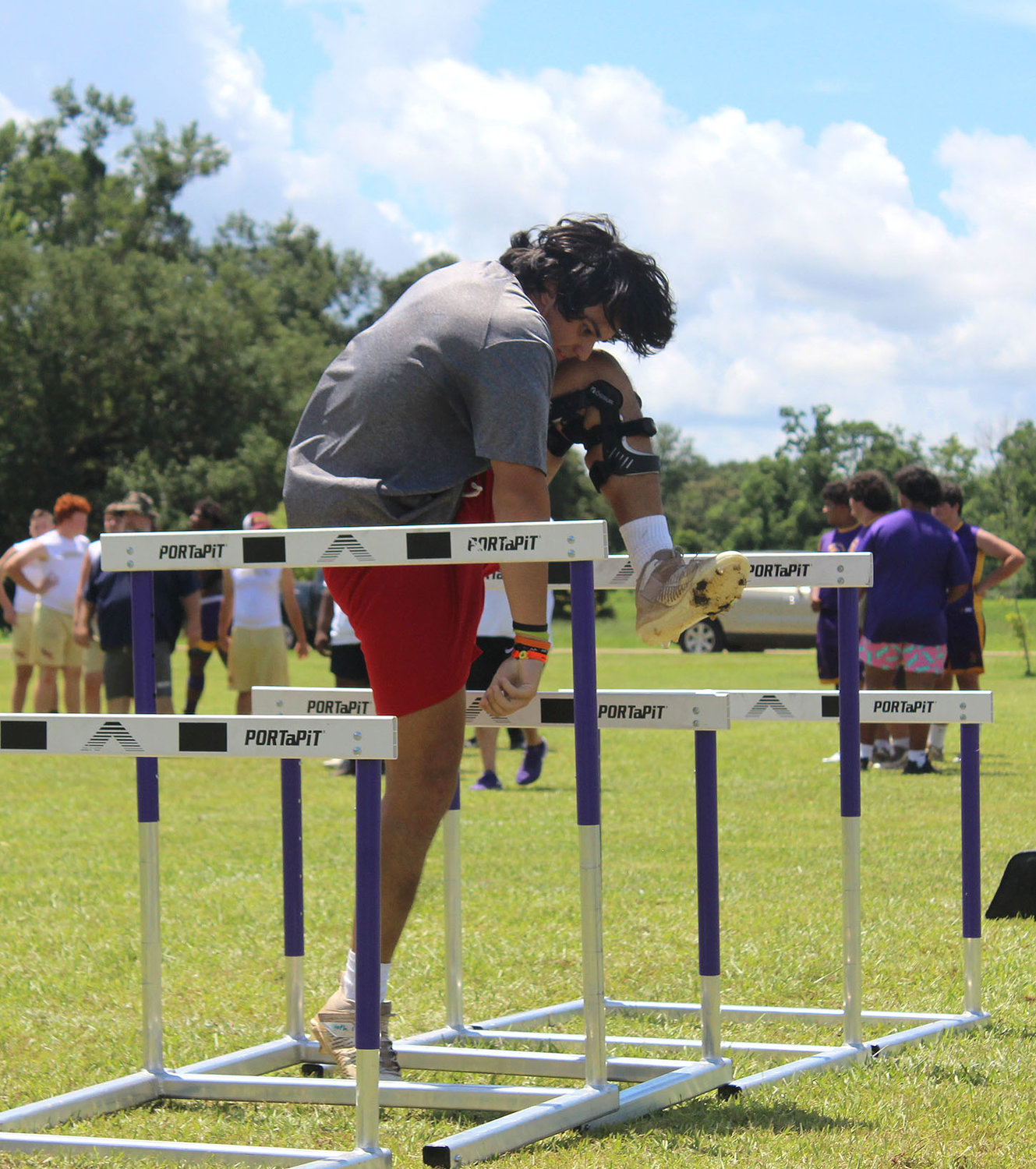 St. Michael junior Jovi Werner maneuvers the hurdles as part of the obstacle course during the Big Man Tournament at Daphne's Al Trione Sports Complex last Thursday.