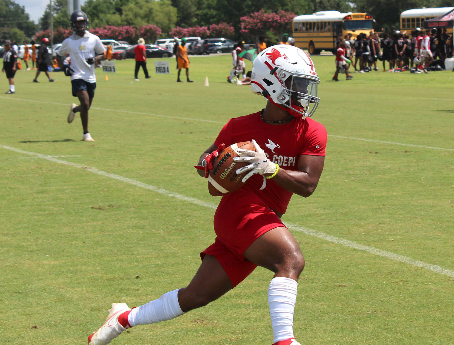 St. Michael senior Braylan Green secures a catch and turns up field for a touchdown during the Cardinals’ pool-play game against the Mobile Christian Leopards at Daphne’s Al Trione Sports Complex during the Jubilee City 7-on-7 Tournament last Thursday.