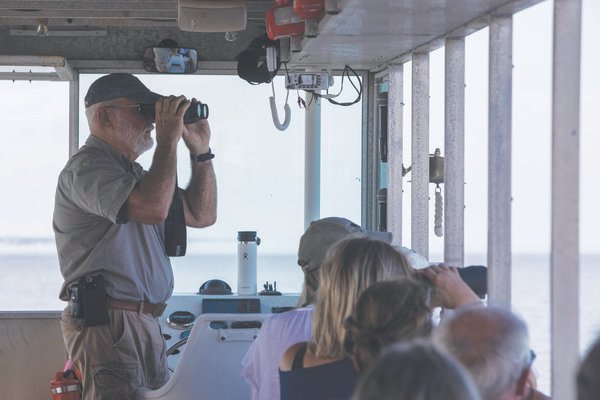 Captain Steve Day, of Blakeley State Park, looks out into Mobile Bay during a cruise aboard the Delta Explorer to visit Middle Bay Lighthouse. During the three-hour cruise, Day pointed out landmarks and animals to visitors.