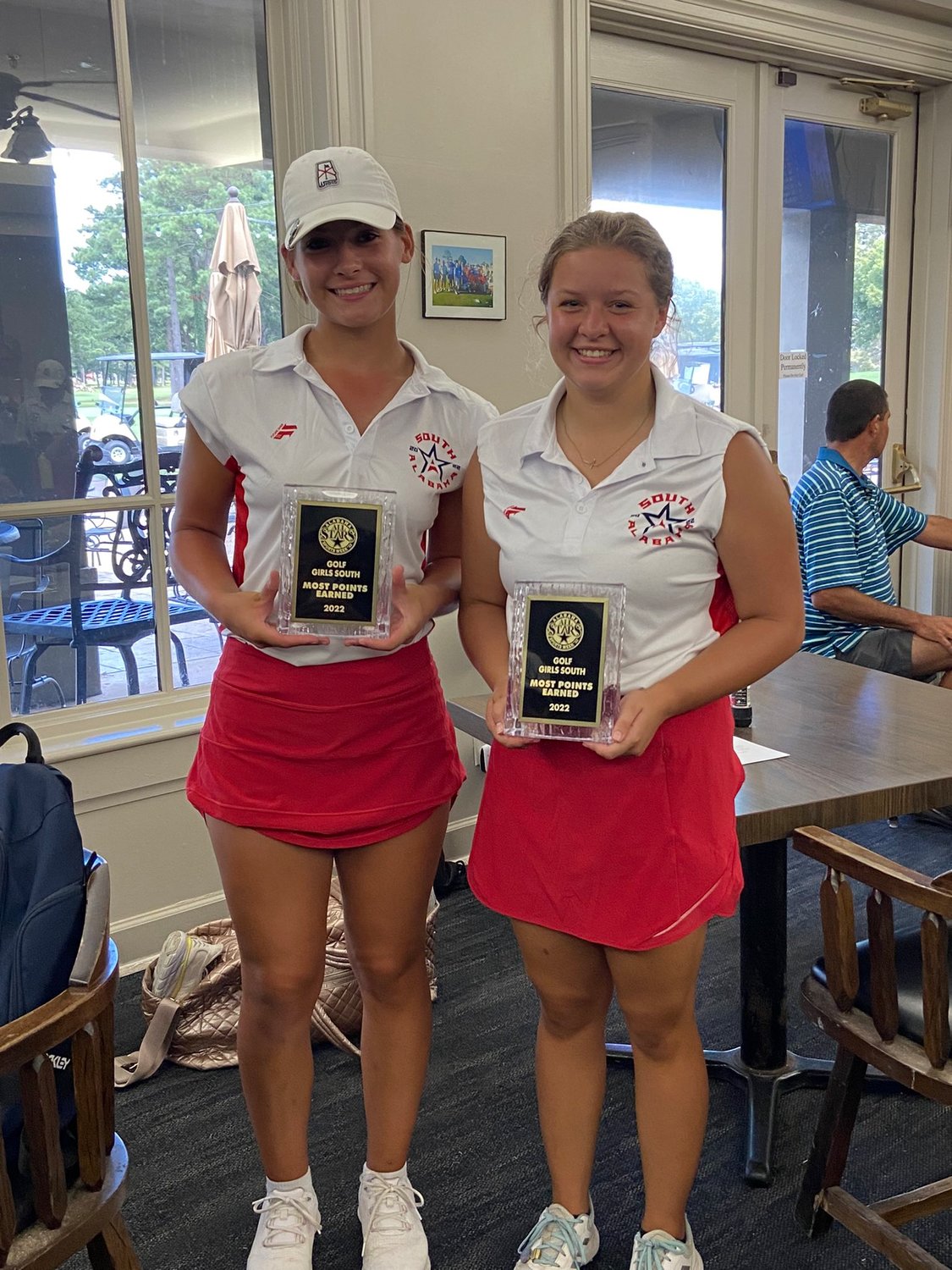Daphne’s Isabel Velazquez (right) and Pike Road’s Yvette Gorden recorded the most points for the South All-Stars in their golf match in Montgomery during the AHSAA North-South All-Star week.