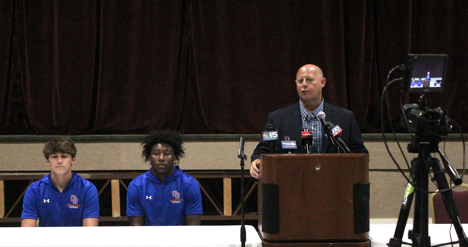 New Mako head football coach Jamey DuBose answers questions at the podium of Trojan Hall in Daphne High School during July 13’s Baldwin County Media Day sponsored by AL.com.