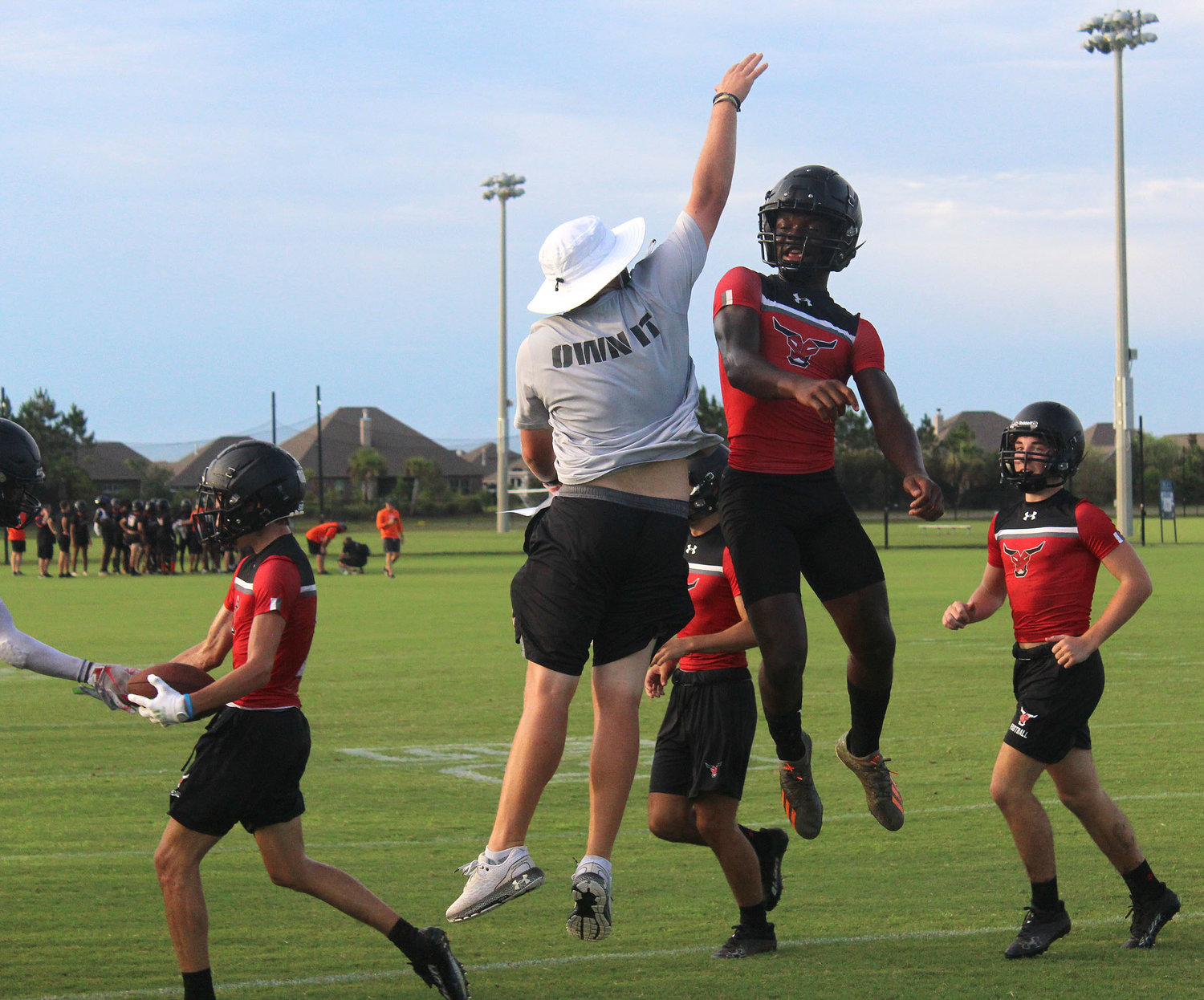 Justin Bonner and the Spanish Fort defense celebrates a turnover at the Foley 7-on-7 Showdown June 29. The Toros were the No. 8 team in the preseason poll as picked by the Alabama Sports Writers Association.