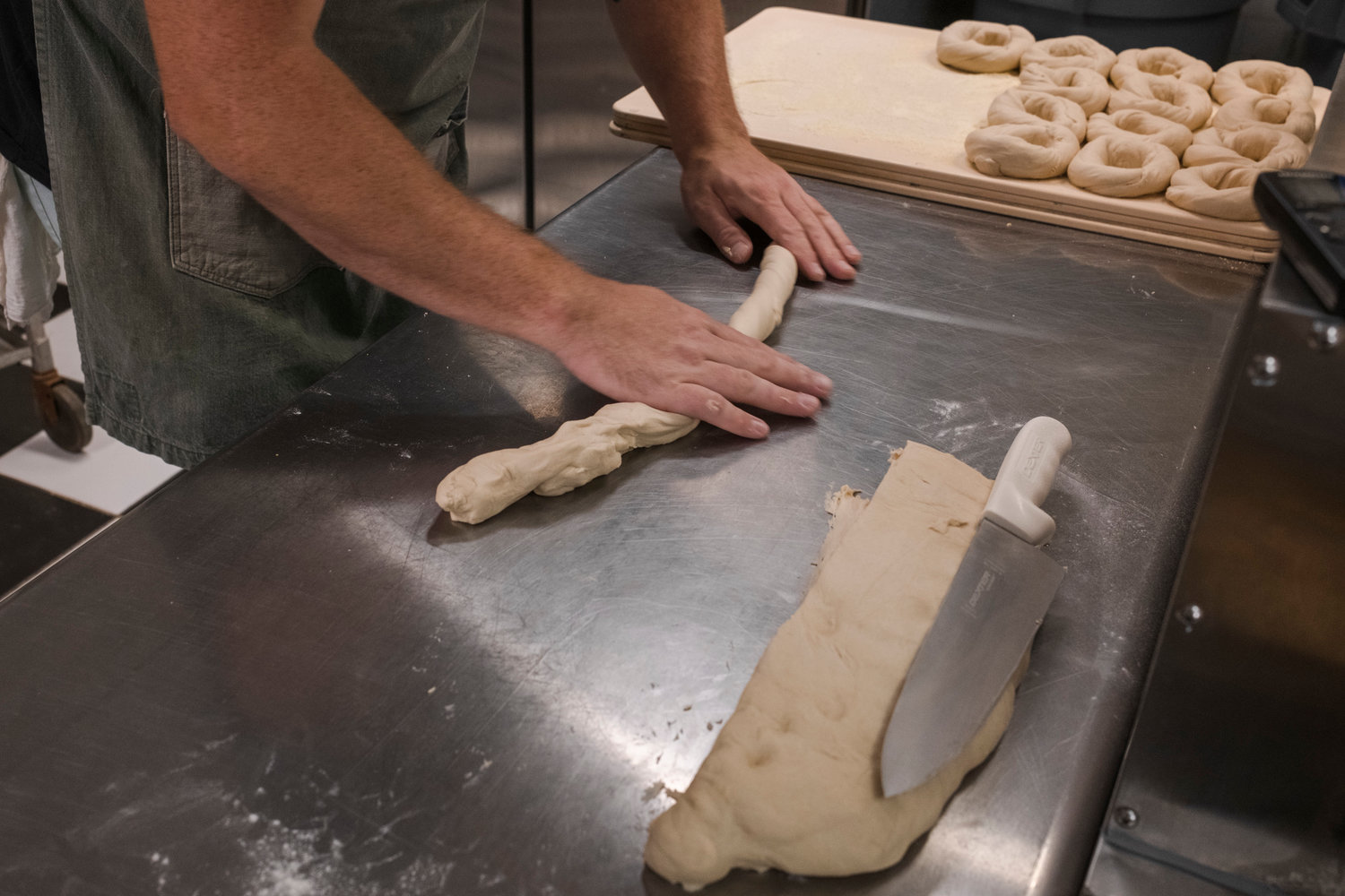 He jokes that he needs someone with smaller hands to roll the bagels so he can get more out of a batch.