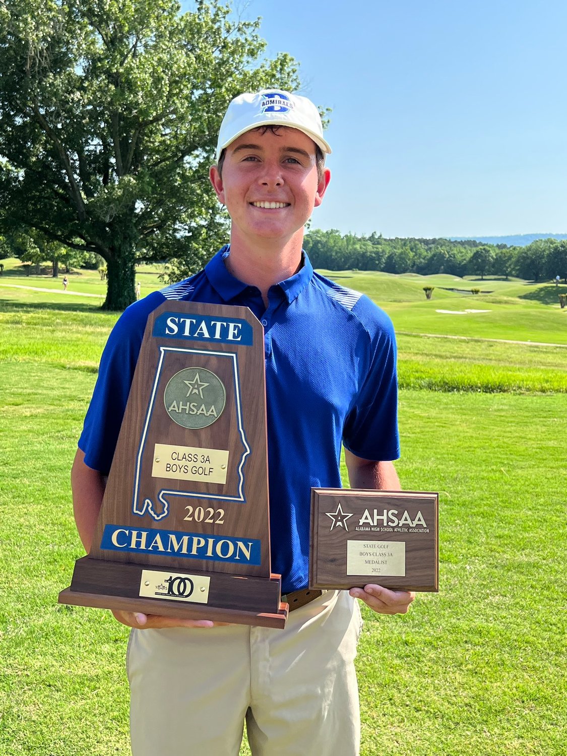 Recent Bayside Academy graduate Cole Komyati with the championship trophies after his individual title helped the Admirals capture the Class 3A team title this spring. Komyati collected 183.5 points over the last year to help land a spot on the Alabama Golf Association’s second-team all-state.