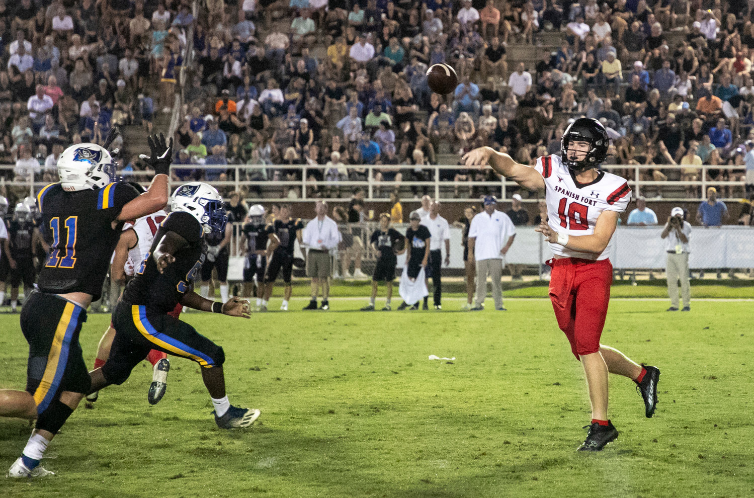 Spanish Fort quarterback Brayden Walker fires a throw from the pocket in the Toros' first game of the season Friday, Aug. 20, at Fairhope Municipal Stadium.