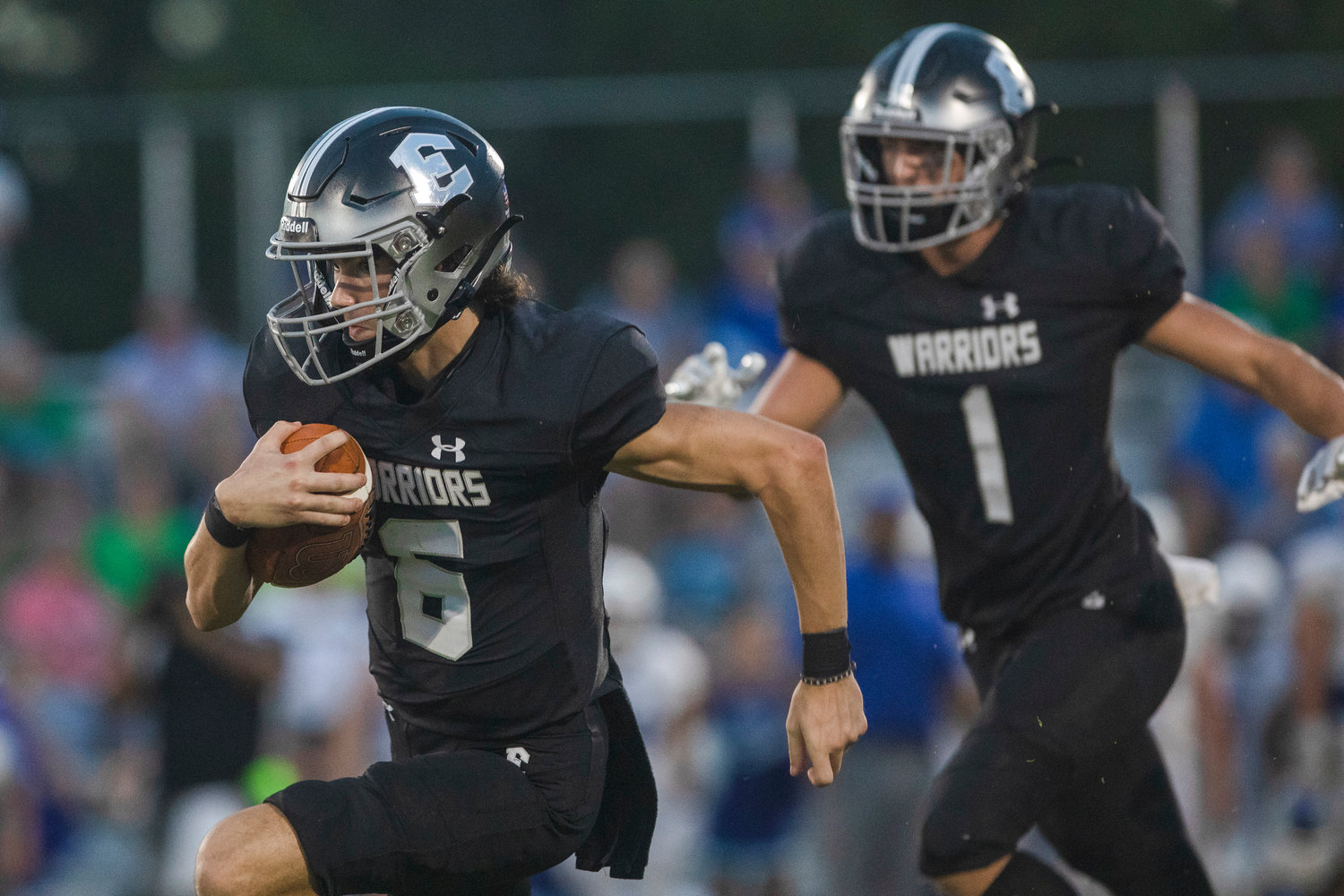 Elberta quarterback Hunter Powers looks for running room in the Warriors’ first game of the year last Friday at home against the Bayside Academy Admirals. Powers and his teammates will hit the road for their first regional game of the year against the Faith Academy Rams Friday night.
