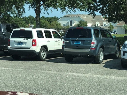 Baldwin County vehicles are parked at the Fairhope Satellite Courthouse. The County Commission is working on new policies for the use of county vehicles.