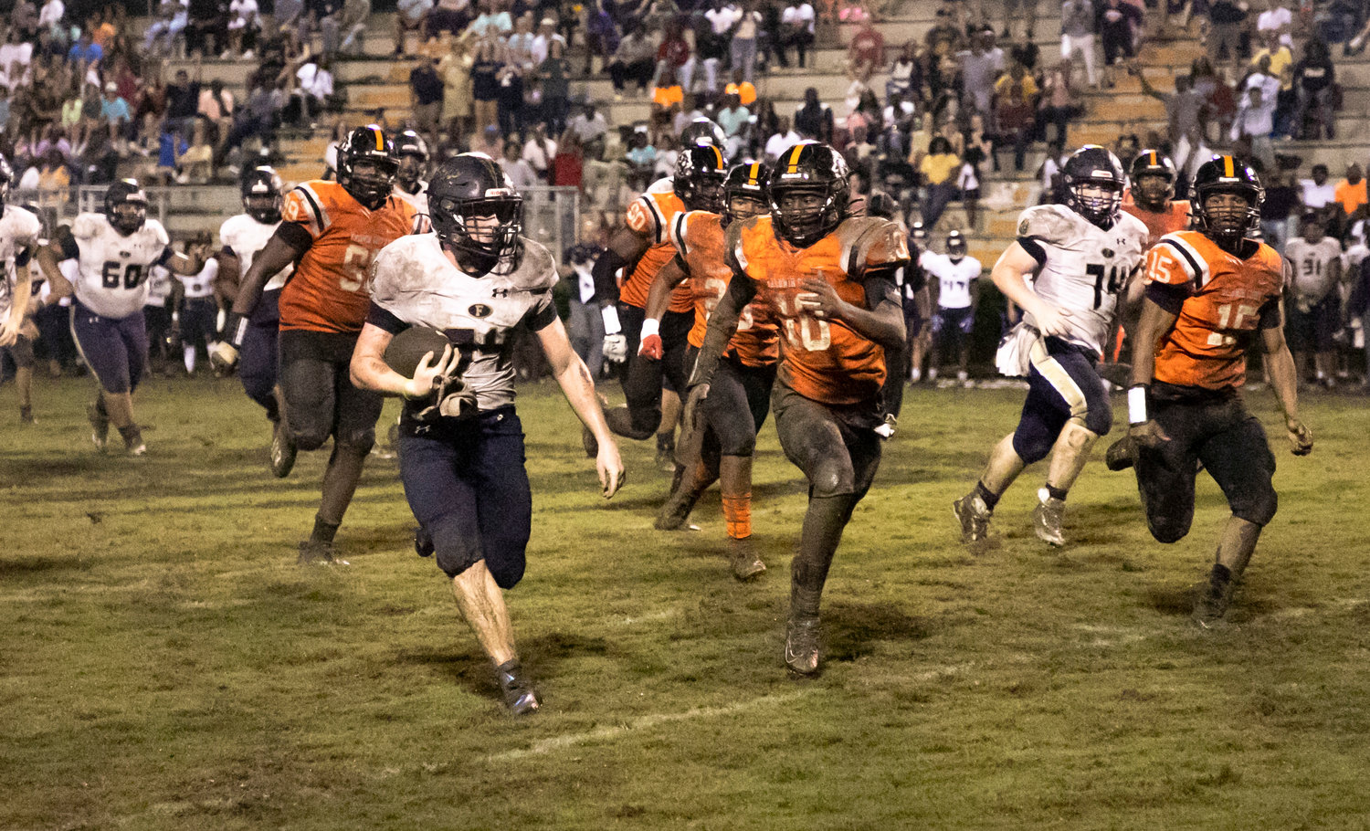 Lions running back Tyler Hamby bends around Tiger defensive back DJ Baker on a second-half run during Foley’s non-region away game against Baldwin County Friday night on Mitchell Field. Hamby’s first-quarter touchdown gave the Lions a lead they would not relinquish.