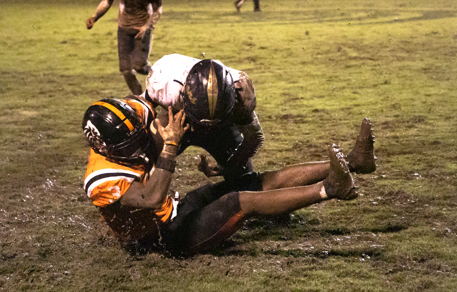 Baldwin County senior Ky McNulty secures a catch in the mud during the Tigers’ non-region game against the Foley Lions Aug. 26 at Lyle Underwood Stadium in Bay Minette. McNulty announced his commitment to the Troy Trojans football program before the season.
