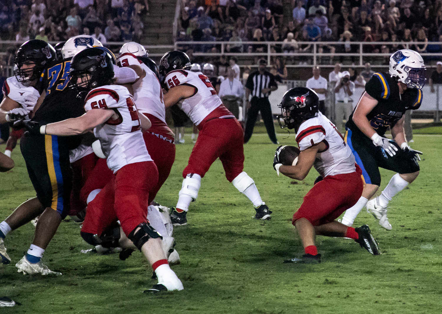 Toro senior Jacob Godfrey (1) looks for running room during Spanish Fort’s season-opening game against Fairhope Aug. 16 on W. C. Majors Field. Godfrey provided the first touchdown as part of the Toros’ 16-6, region-opening win over the Blount Leopards on the road last Friday.