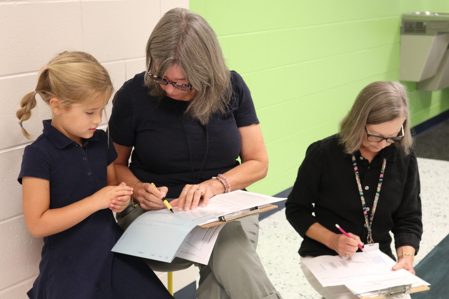 Part-time interventionalists, often retired teachers, offer one-on-one time with children to assist them in reading or other areas.