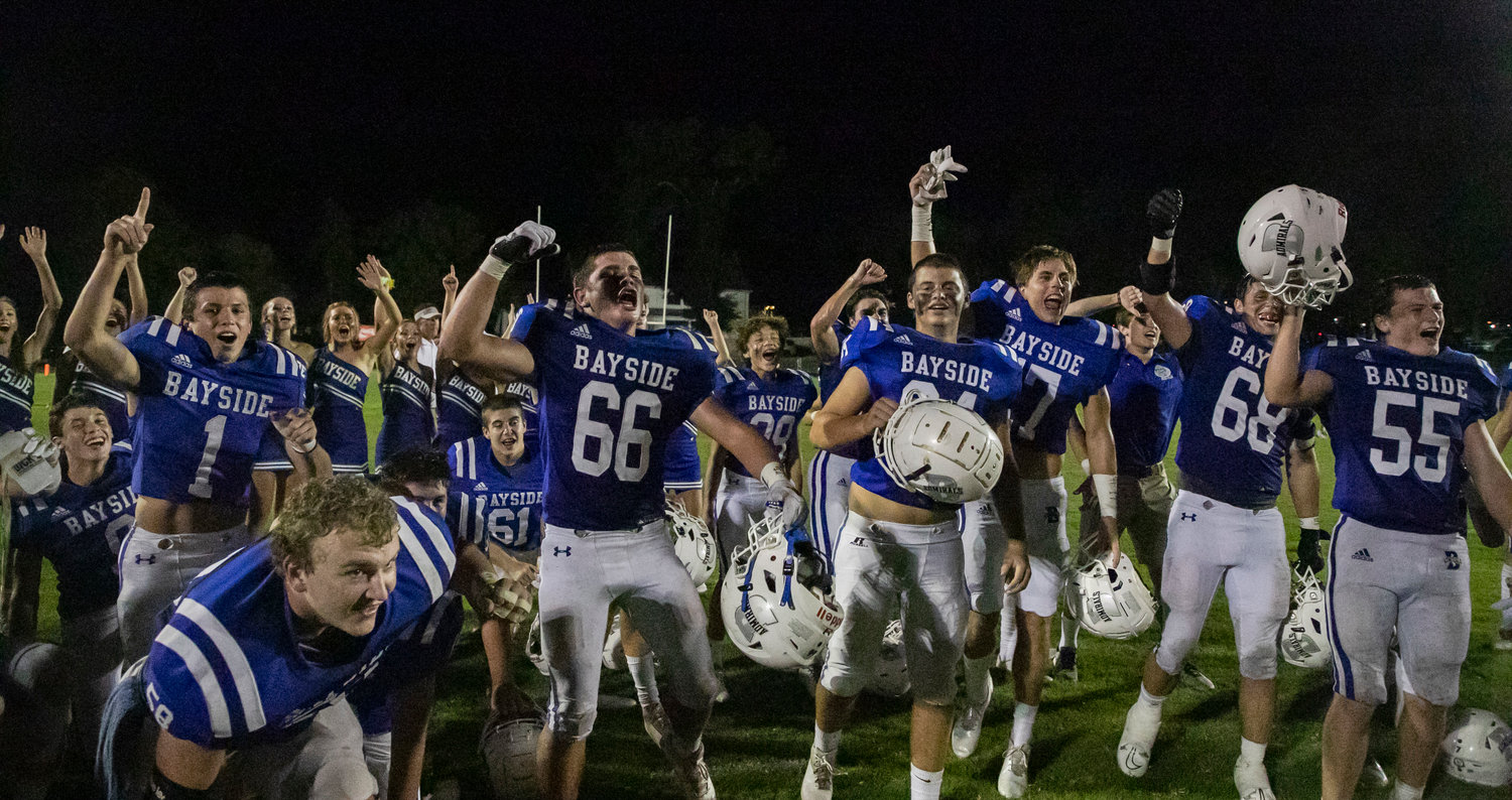 The Bayside Academy Admirals celebrate their region-opening, 17-14 win over the St. Michael Catholic Cardinals Friday night on Freedom Field. Joey Jones hit a 20-yard field goal with less than a minute to seal the win.