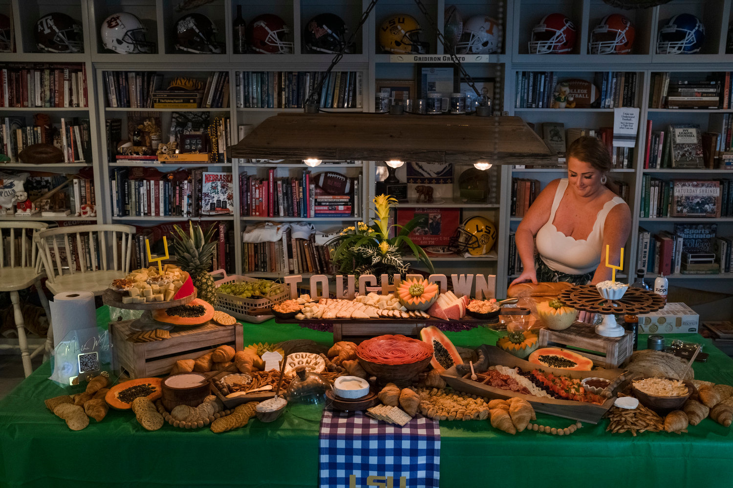 Martha Ann Merritt Taylor, owner and creative genius behind Martha May's Charcuterie and Catering, sets up for a football party in a client's home.