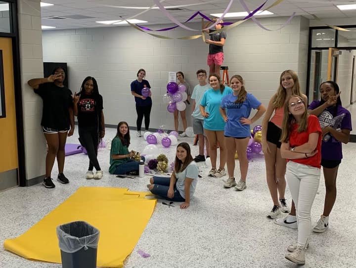 Daphne High School SGA members took to the halls to decorate prior to homecoming week. The students adjourned the halls in purple, white and gold in preparation for the festivities.