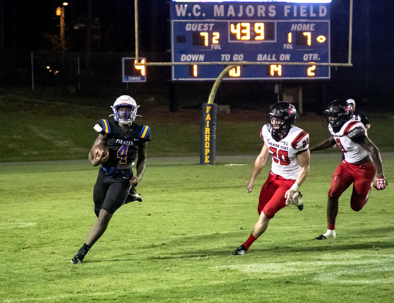 Fairhope running back Qualin McCants looks for the corner on a run during the Pirates’ season-opening game against Spanish Fort Aug. 19 at home. McCants supplied three rushing scores to help Fairhope be one of three local teams to remain undefeated through Week 4 of the season.