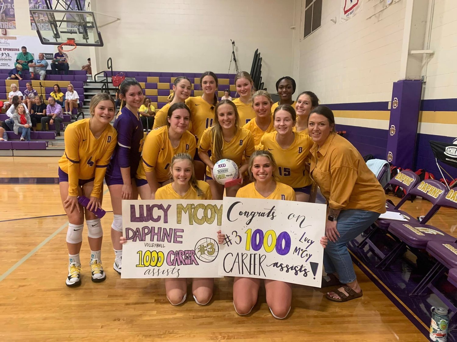 The Daphne Trojans celebrated their setter, Lucy McCoy, reaching 1,000 career assists Tuesday night at home.