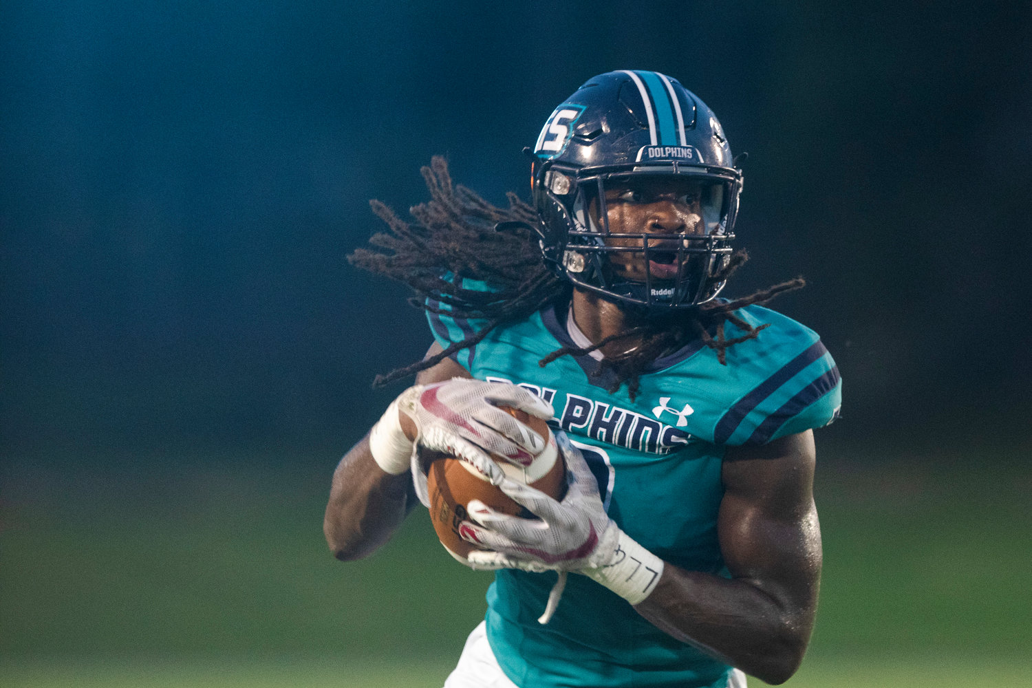 Gulf Shores junior Ronnie Royal secures a catch and looks to make a move in the Dolphins’ season-opening game against St. Michael Catholic Aug. 18. Gulf Shores checked in at No. 7 in this week’s ASWA rankings heading into Week 5.