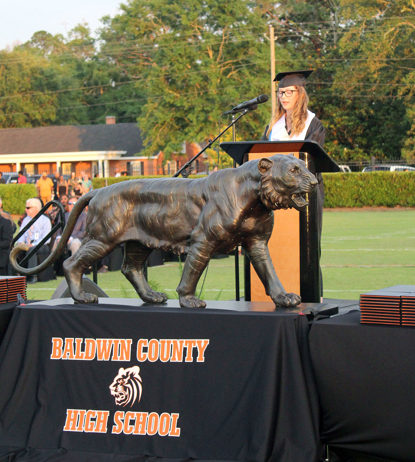 Baldwin County student body president McKenzie Bryant speaks during the Class of 2022’s commencement Thursday, May 19, at Lyle Underwood Stadium in Bay Minette. The former Tiger football manager is now a student assistant inside linebacker coach with the Troy Trojan football team.