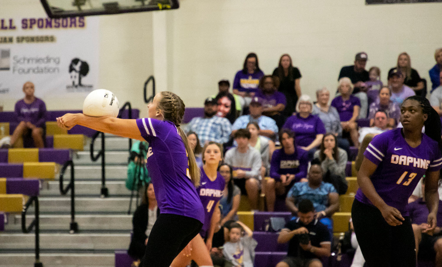 Daphne junior setter Lucy McCoy bumps a pass during the Trojans’ area match against the McGill-Toolen Yellow Jackets Tuesday, Sept. 20, at home. McCoy surpassed 1,000 assists as a Daphne Trojan this season to help her team surpass last year’s win total and climb to No. 37 in MaxPreps rankings.