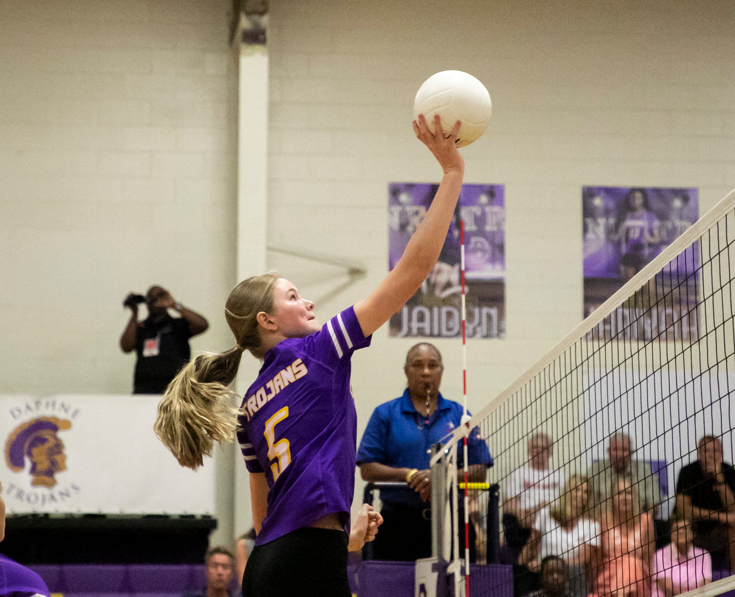 Trojan freshman middle block Charlette Mekkers connects on a spike during Daphne’s home area match against the McGill-Toolen Yellow Jackets Tuesday, Sept. 20.