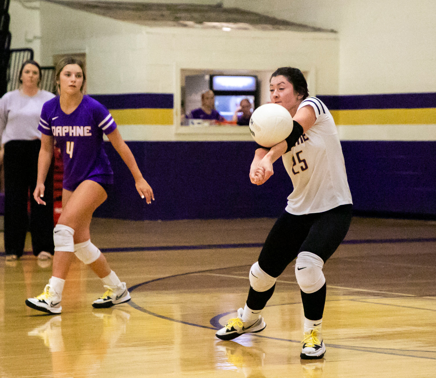 Daphne senior libero Maddie Hammond receives a serve from a McGill-Toolen Yellow Jacket Tuesday, Sept. 20, in area action at Daphne High School. McGill-Toolen swept 3-0.