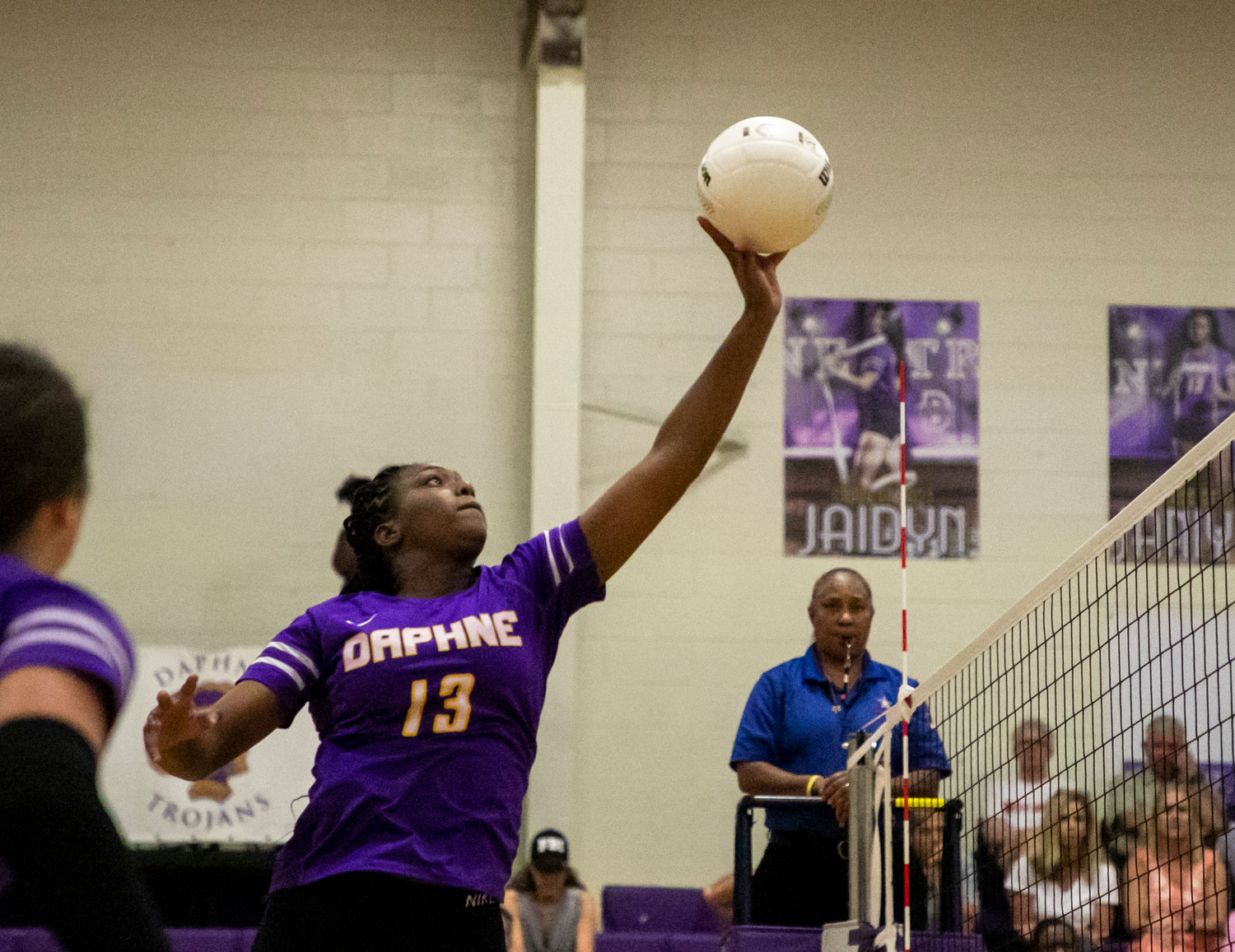 Trojan senior outside hitter Janiyah King rises for an attack against the McGill-Toolen Yellow Jackets Tuesday night in area action.